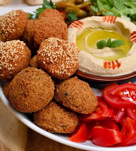 fried-falafel-on-a-plate-with-hummus-and-veggies